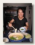 Miki-san prepares hotpot in a nabe - a large earthern stove pot. I hope to bring one back in the Bike Friday suitcase! IMG_5311